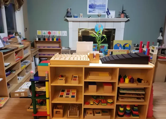Spacious and bright main classroom at Genesis Preschool, organized with Montessori learning materials.